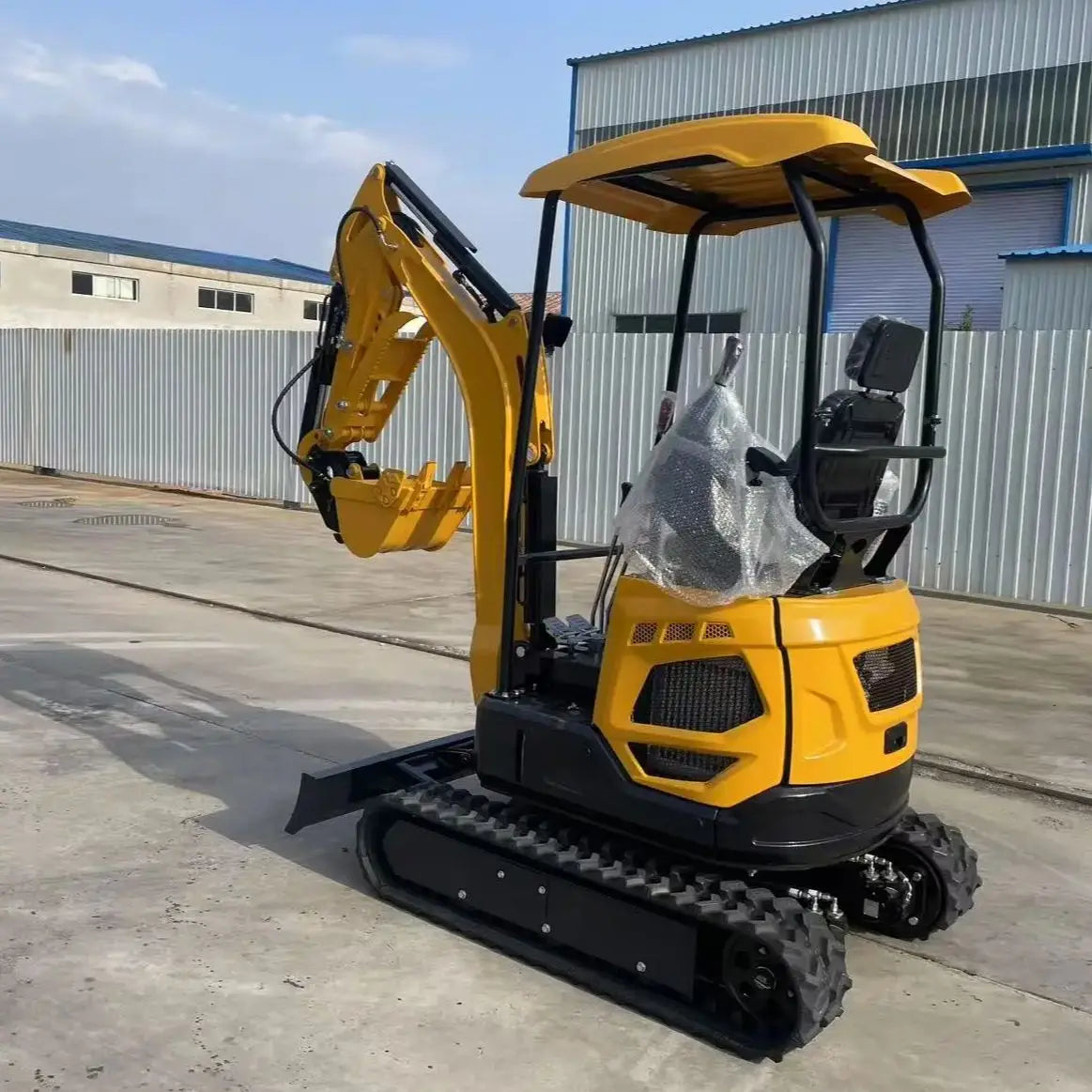 Small excavator with a capacity of 1.8 tons is used for free transportation of new Kubota engines for construction farms