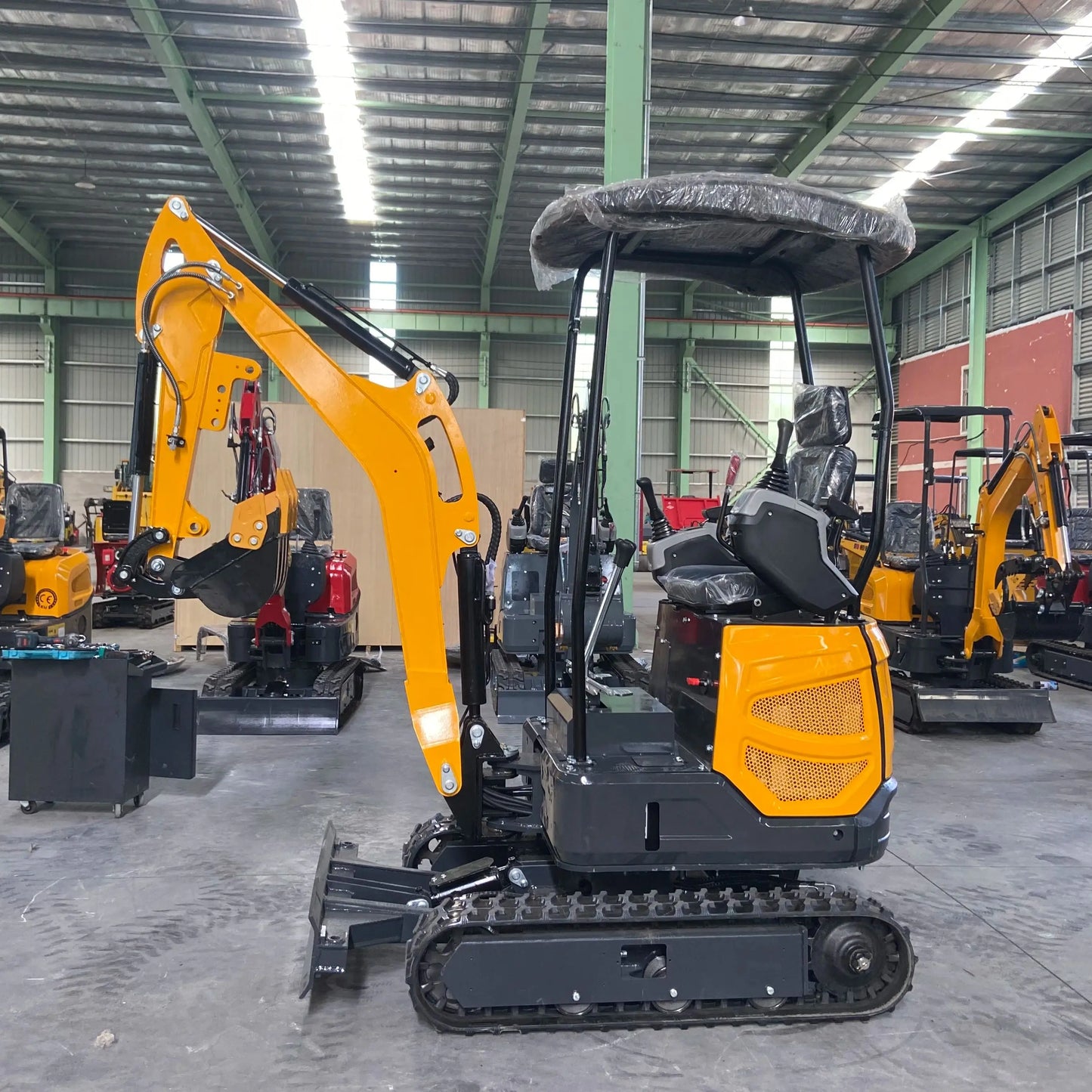 Small excavator with a capacity of 1.8 tons is used for free transportation of new Kubota engines for construction farms