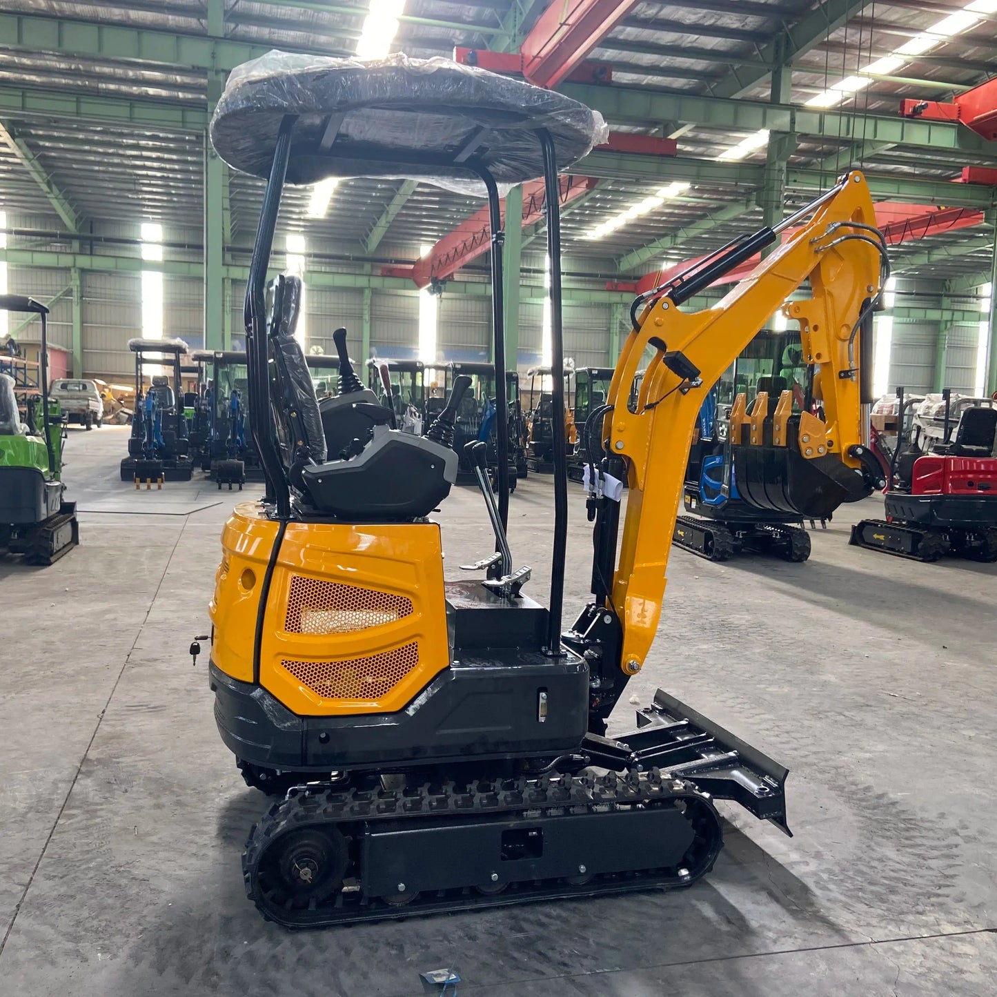 Small excavator with a capacity of 1.8 tons is used for free transportation of new Kubota engines for construction farms