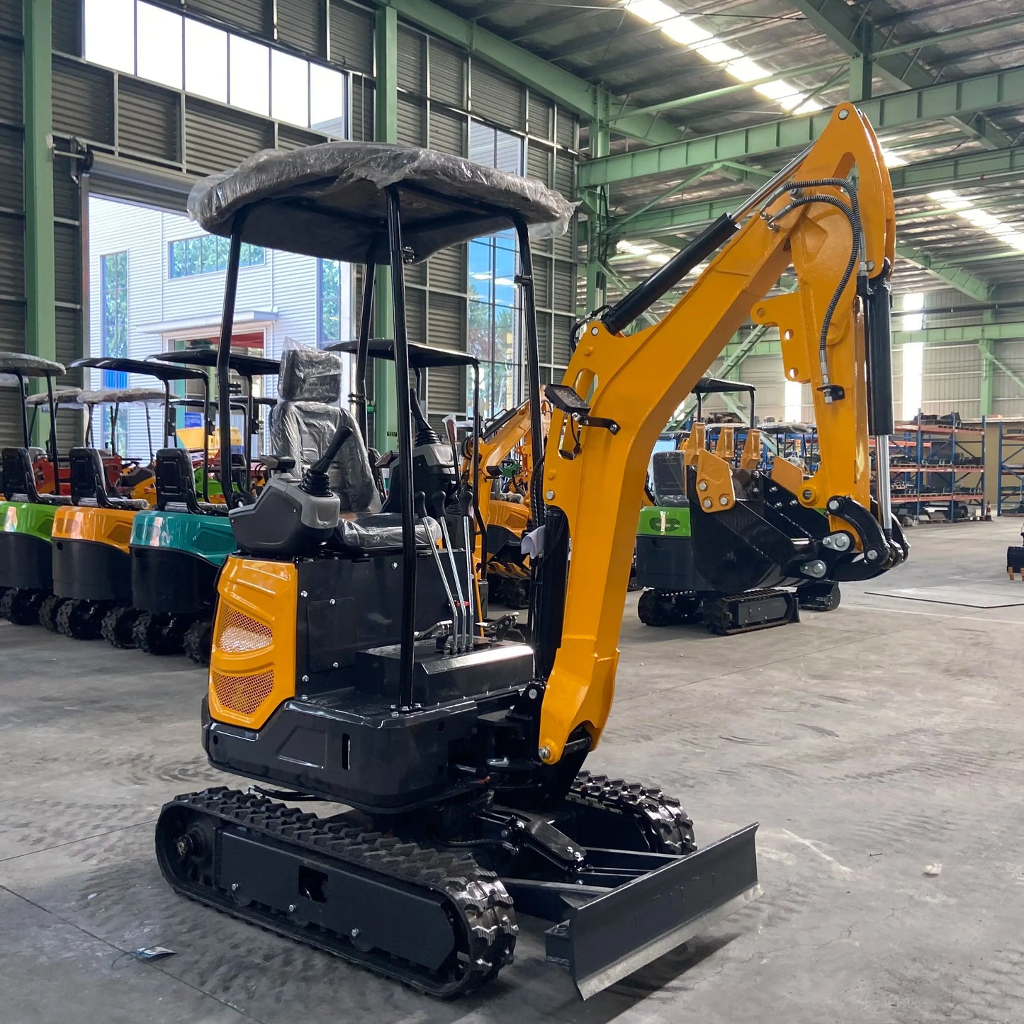Small excavator with a capacity of 1.8 tons is used for free transportation of new Kubota engines for construction farms
